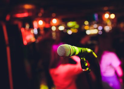 Microphone on stage against a background of auditorium